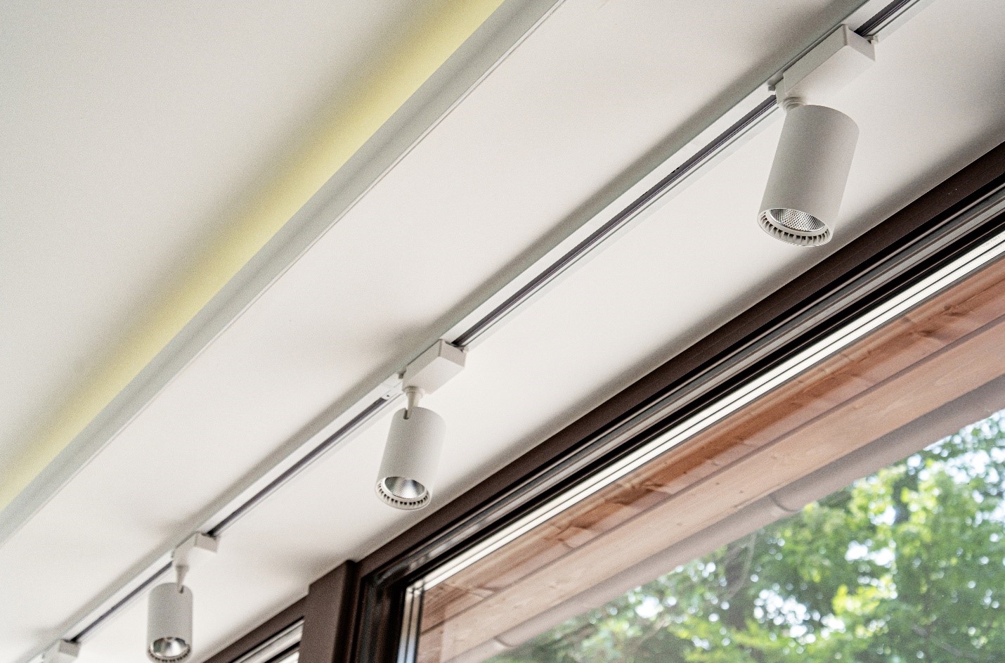 A row of track lights above a door.