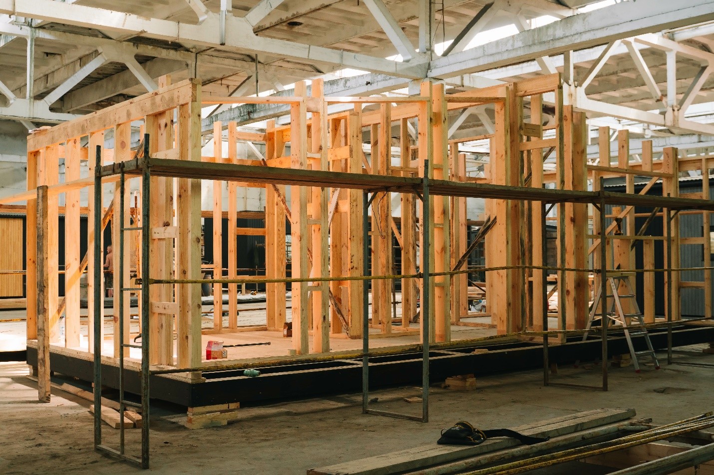 A manufactured pre-fabricated home being built in a factory.